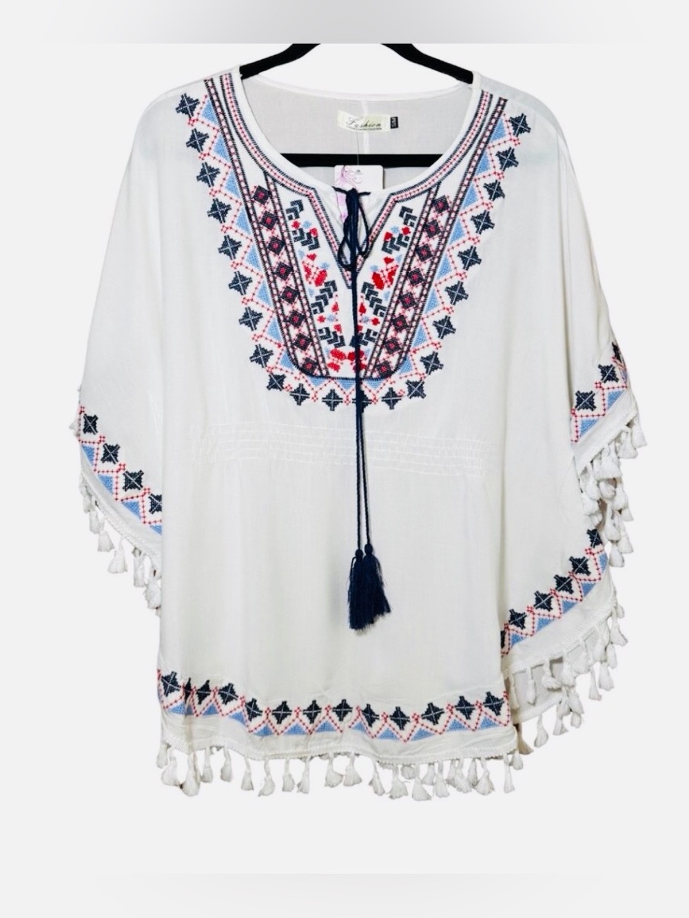 Poncho light and breezy. Embroidered white, navy, red. Boho chic. Fits up to L